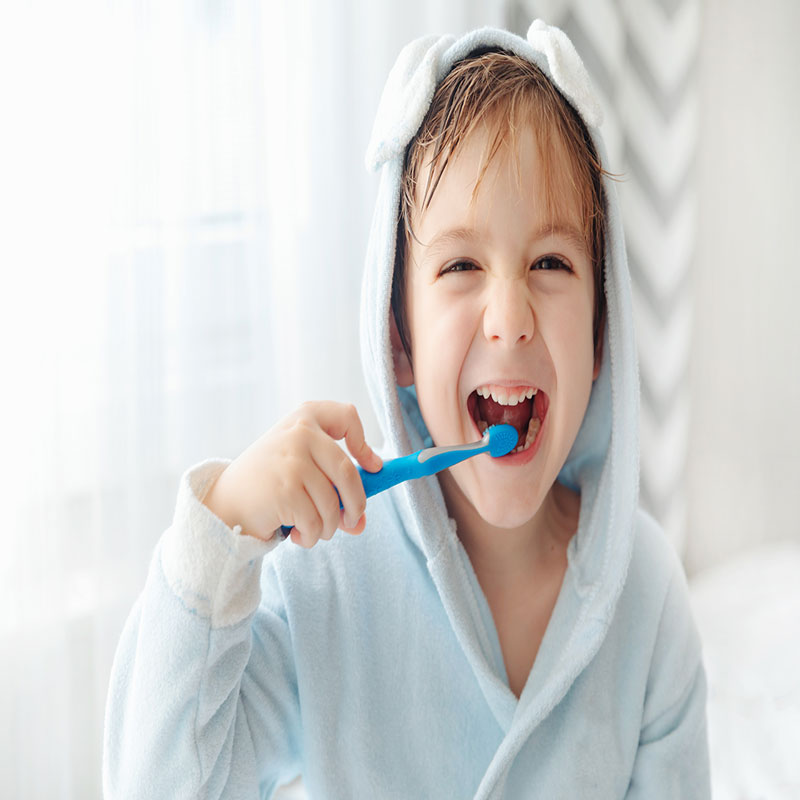 smiling happy child brushing teeth with toothbrush 2022 09 19 21 54 15 utc